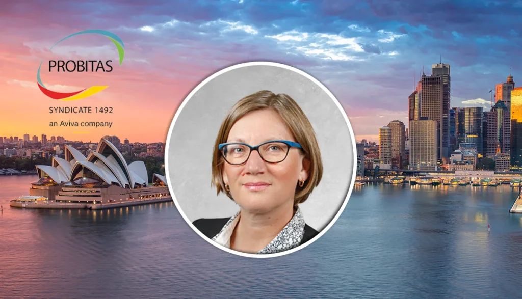 Portrait of a professional woman with blue glasses, circular headshot centered over a Sydney harbor scene with the Probits logo in the sky, suggesting a corporate staff/profile image.
