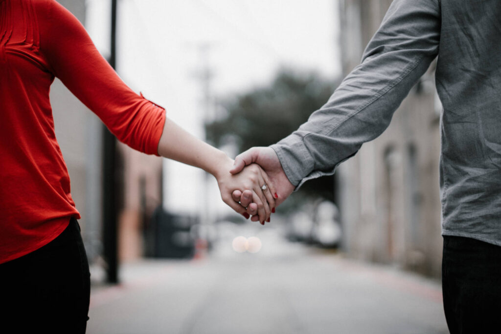 Couple holding hands