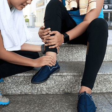 asian woman sitting steps street holding friend s ankle 1