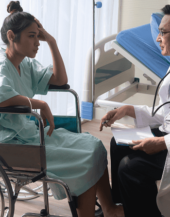 doctor discussing with patient while sitting hospital 1