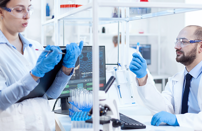 young man scientist looking pensive chemical solution test tubes team chemical chemists working together sterile microbiology lab doing research 1