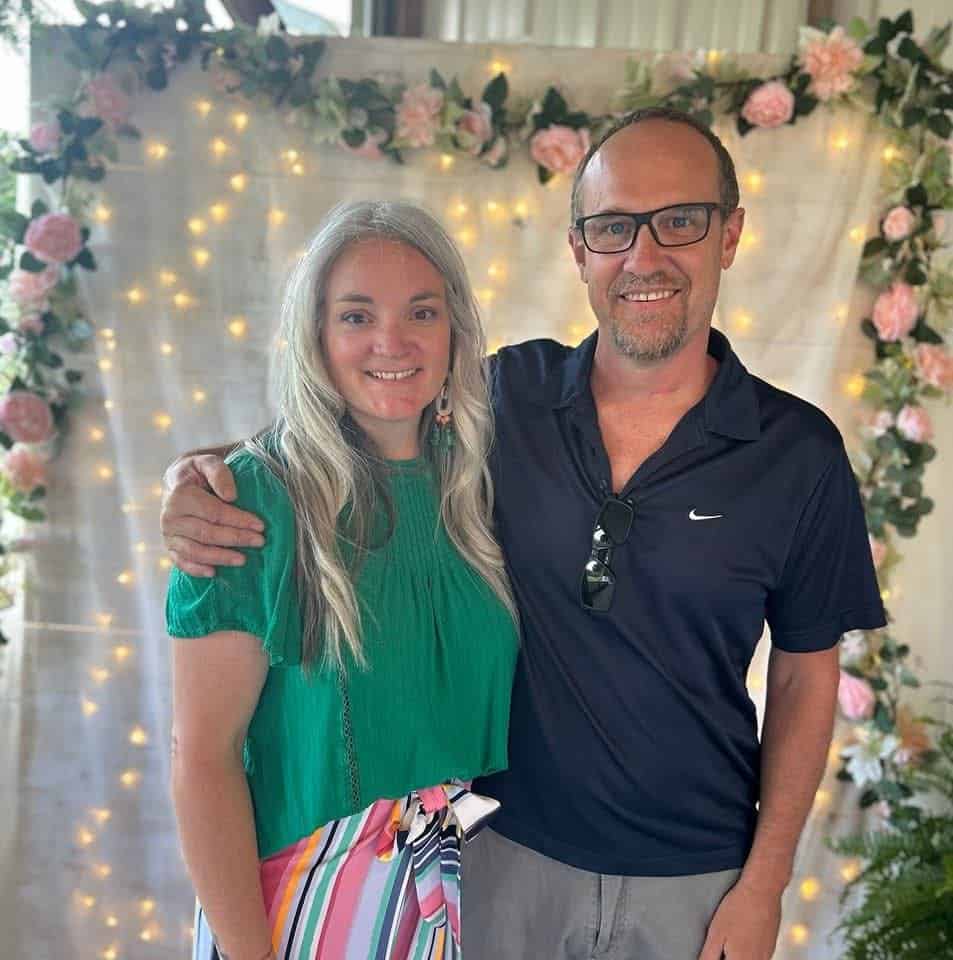 Riverside Coffee Shop with a couple enjoying their time, decorated with flowers and fairy lights, cr.