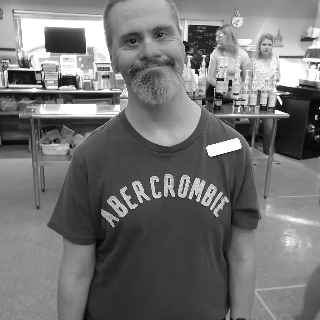 Meet the staff 4 Friendly staff member at Riverside Coffee Shop ready to serve customers.