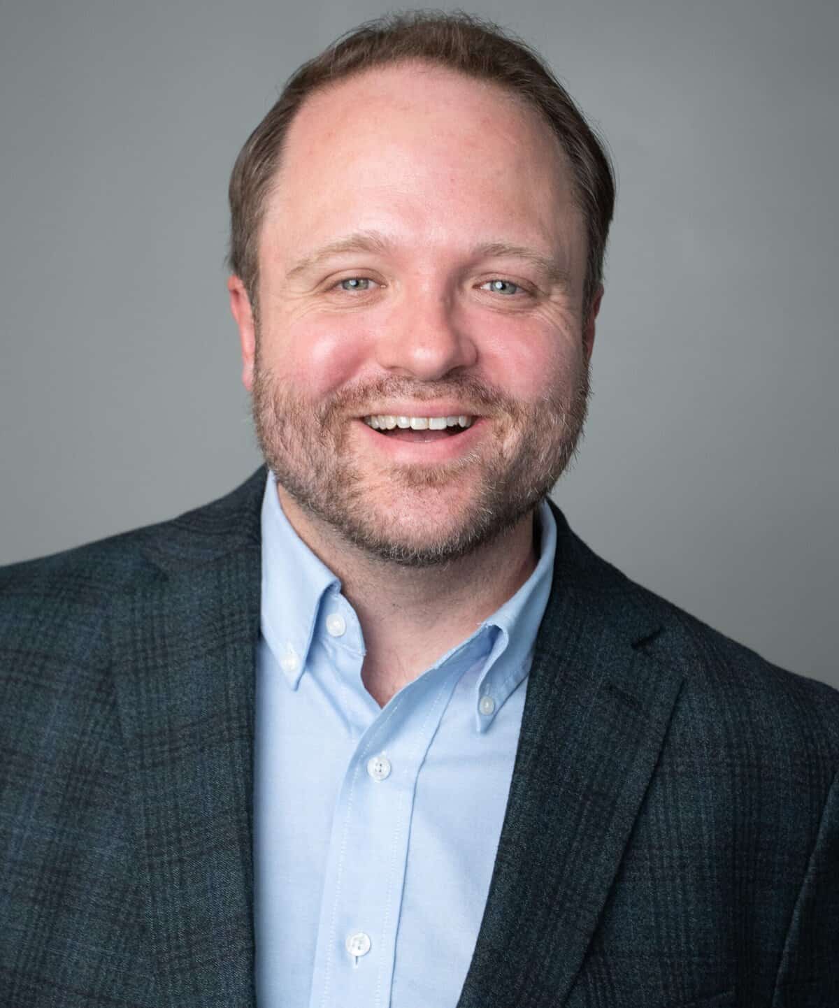 Meet the board 4 Board members smiling during a meeting at Riverside Coffee Shop.