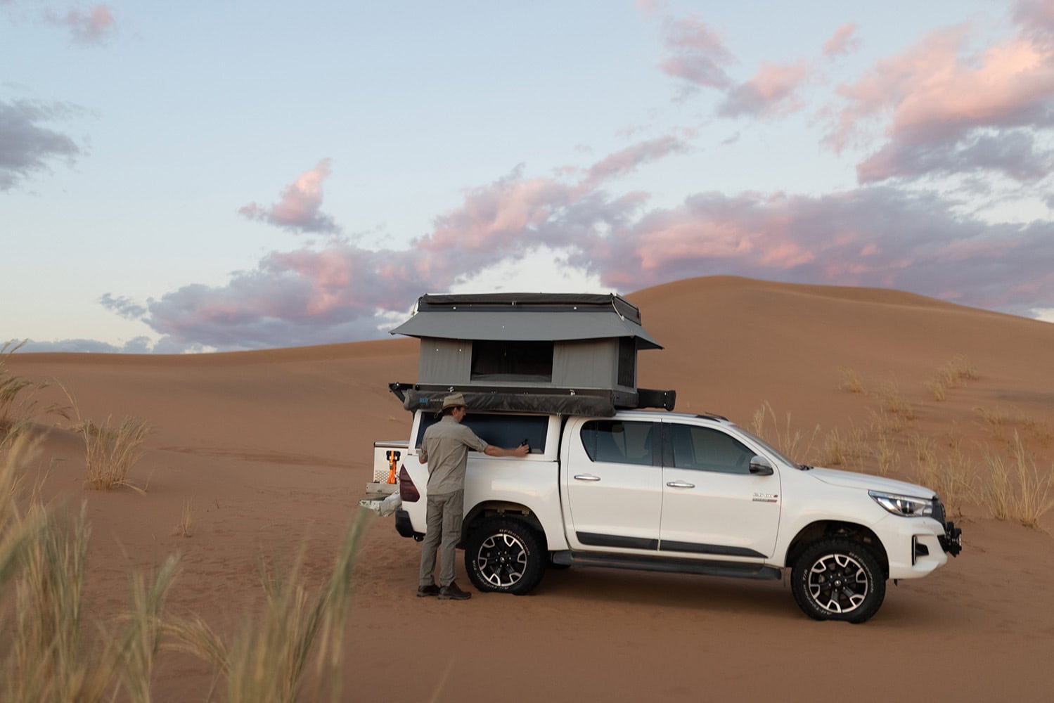 High-quality stainless steel canopy installation on off-road vehicle for durability and style in desert environments.