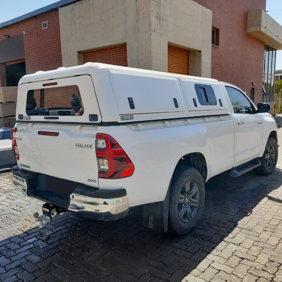 Weather-resistant stainless steel canopy for vehicle storage and protection, custom-designed for durability and style, ideal for trucks and utility vehicles.