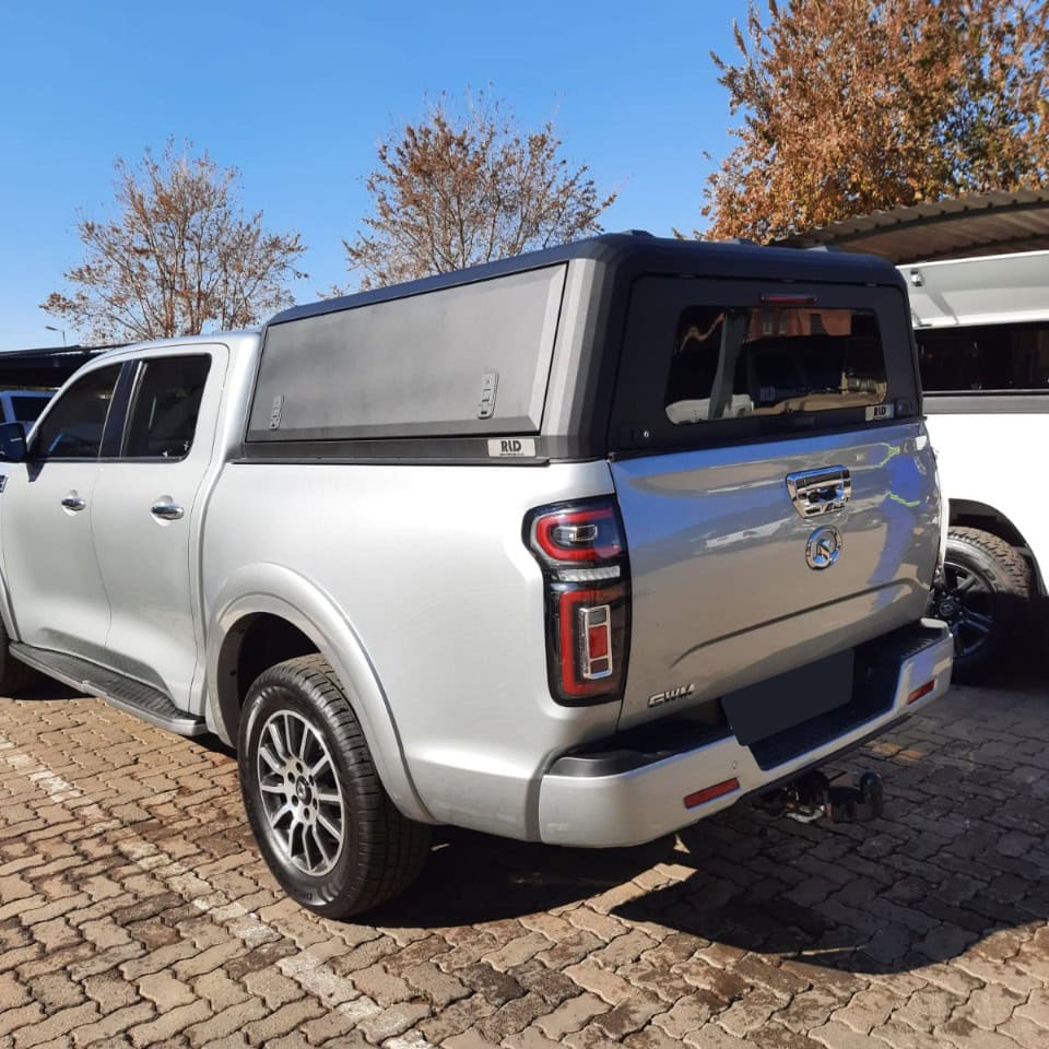 Custom stainless steel canopy for pickup trucks, durable and rust-resistant.