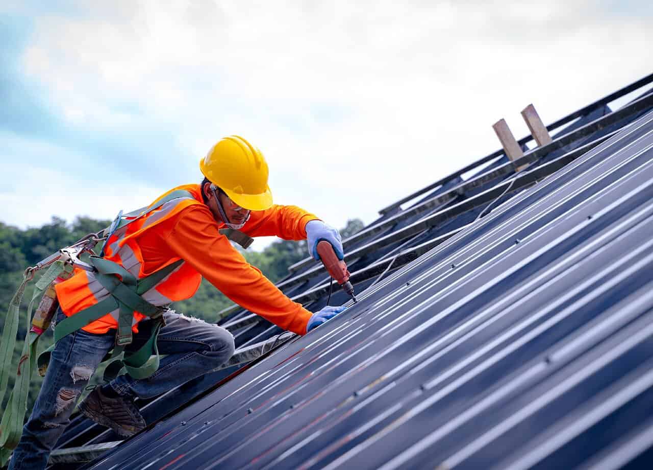 A photo of a roof with a gutter drain installed, advertising Roofing For Troops' gutter cleaning services