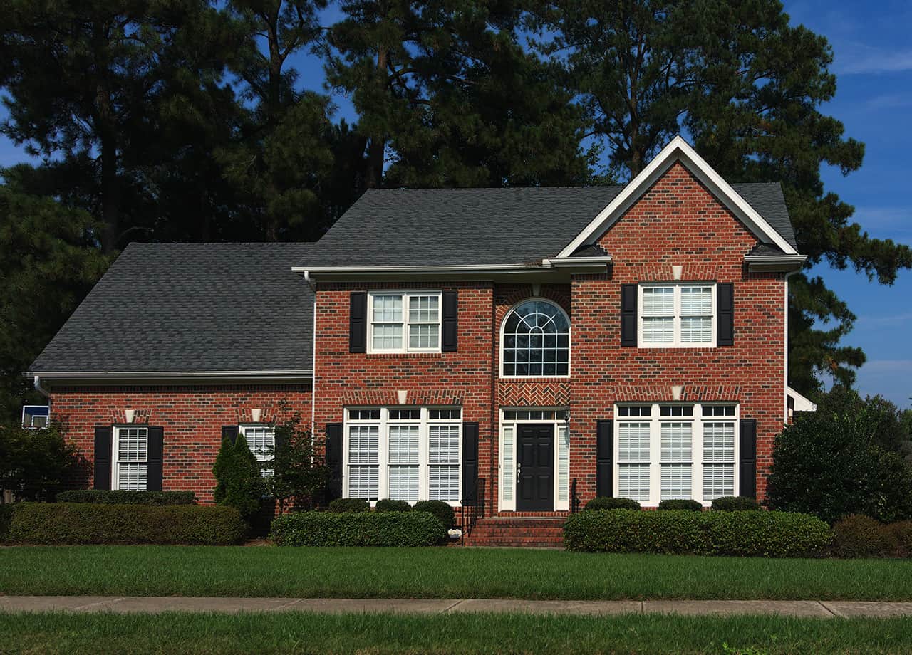 Brick siding on a home in Cincinnati OH Image of a large house with red brick siding in Milford OH.