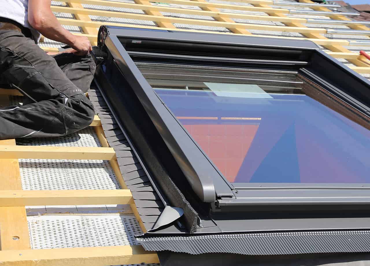 Skylight Installations Milford OH _ Cincinnati OH Image of one of our roofing contractors installing a skylight on the roof of a home in Cincinnati OH.