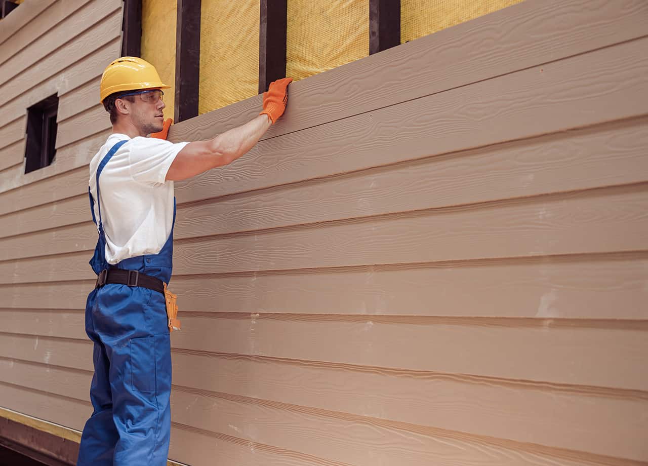 installing siding in Milford OH Image of one of our contractors installing siding on a home in Milford OH.