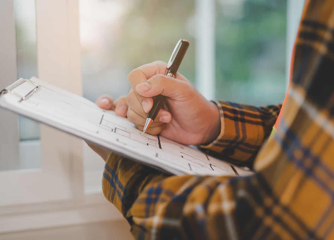 quality siding services Milford OH _ Cincinnati OH Image of a home contractor filling out a form. Roofing For Troops cares about quality services. We provide siding repair & installation services in the Milford OH & Cincinnati OH areas.