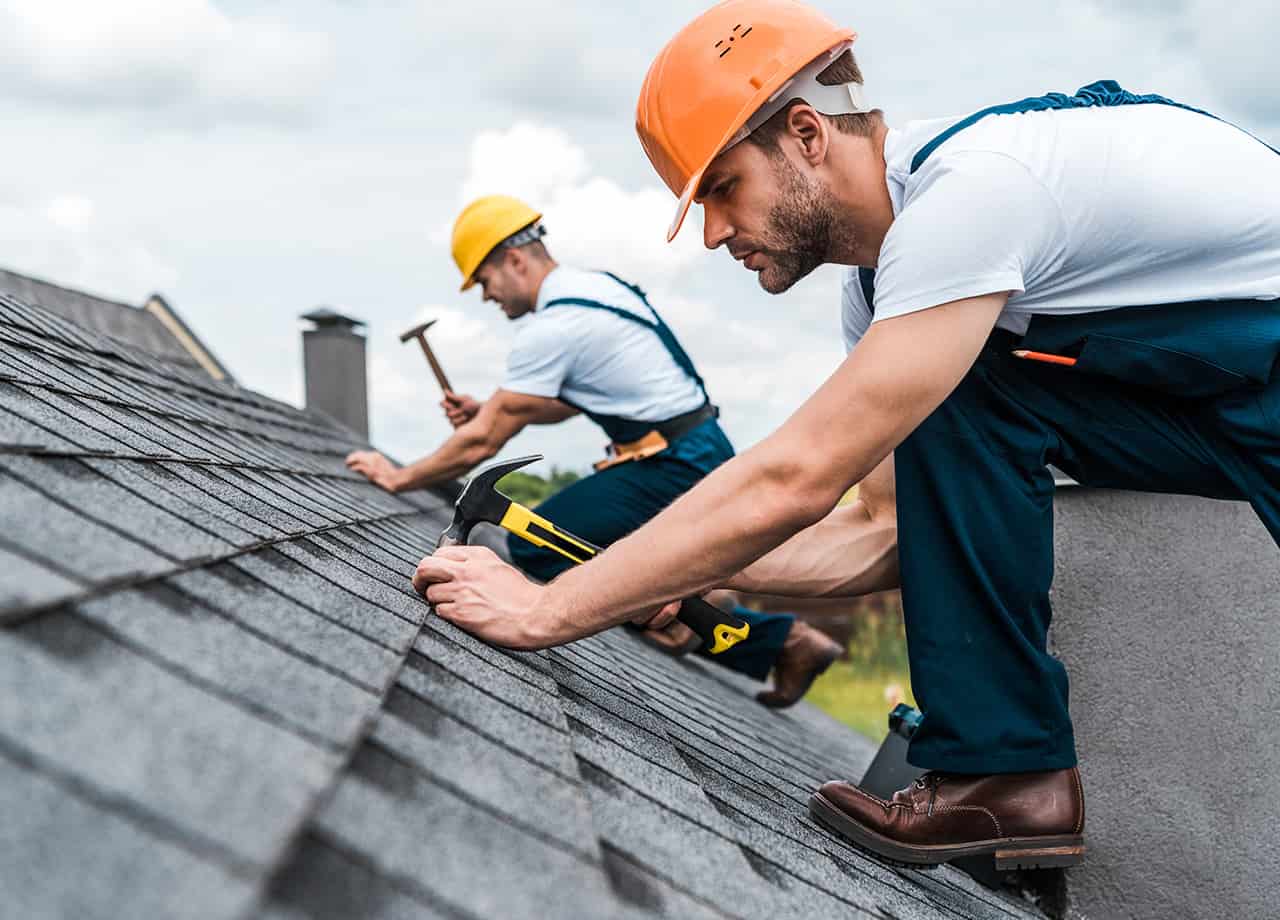roof leak repairs Milford OH _ Cincinnati OH Image of our roofing contractors in Cincinnati OH & Milford OH repairing a roof that has been leaking.