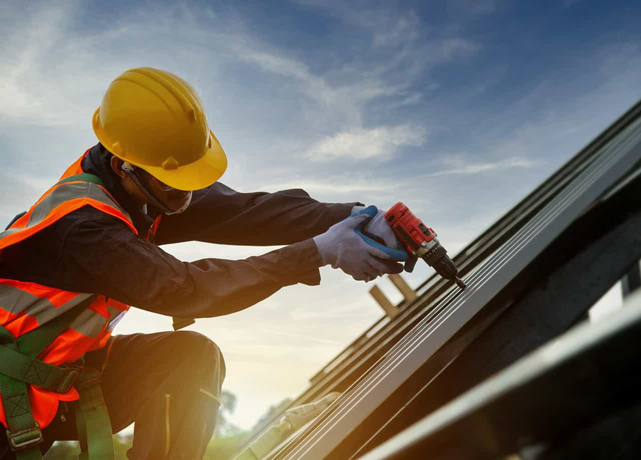 roofing contractor in Cincinnati Oh repairing a roof leak Image of our roofing contractor in Milford OH promptly repairing a roof that has a leak.