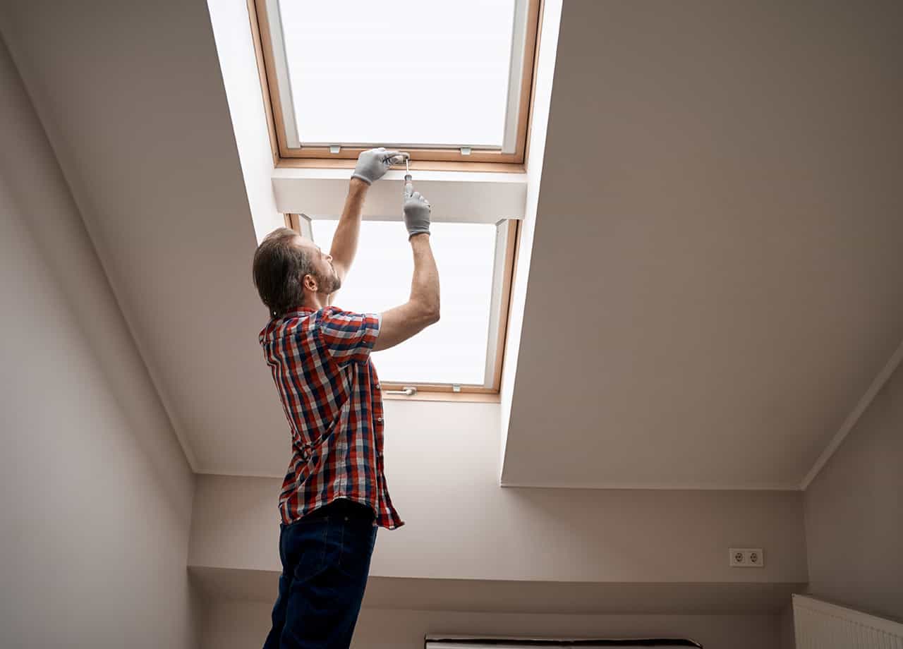 skylight installation and maintenance Milford OH image our skylight installation expert performing skylight maintenance. We install skylights for residents in Milford OH, Cincinnati Oh, and surrounding Ohio areas.