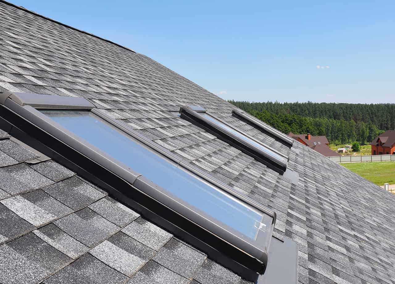 skylights on an asphalt roof Image of a asphalt roof that has skylights installed on it. We are skylight installation experts in Milford OH, Cincinnati OH, and the surrounding Ohio areas.