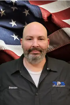 a man in front of a flag