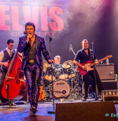 Elvis Presley tribute band performing live on stage at RTV SLOS, capturing the iconic rock 'n' roll style.
