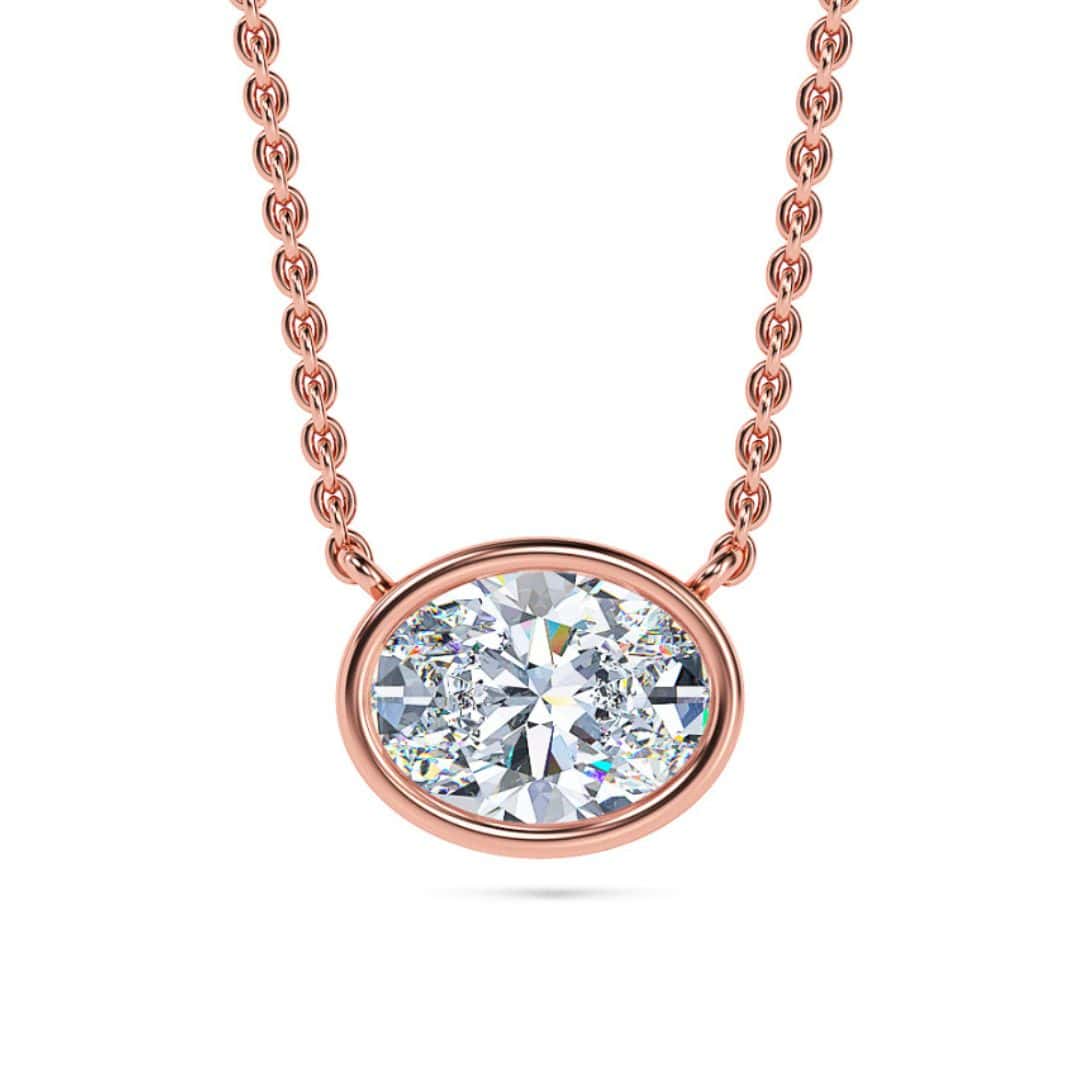 Elegant oval bezel solitaire diamond pendant necklace in rose gold. Perfect for sophisticated jewelr.