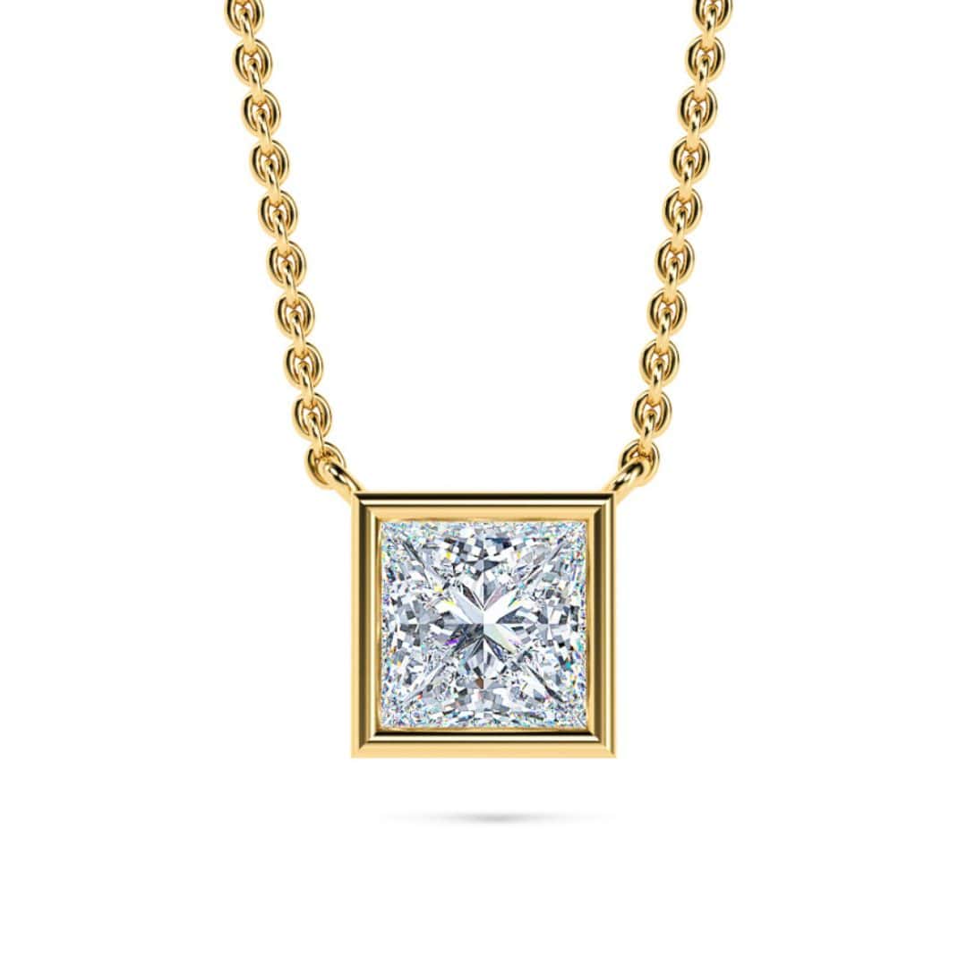 Elegant princess-cut diamond pendant necklace with gold chain.