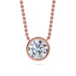 Elegant rose gold necklace with a round bezel-set solitaire diamond pendant. Perfect for sophisticat.