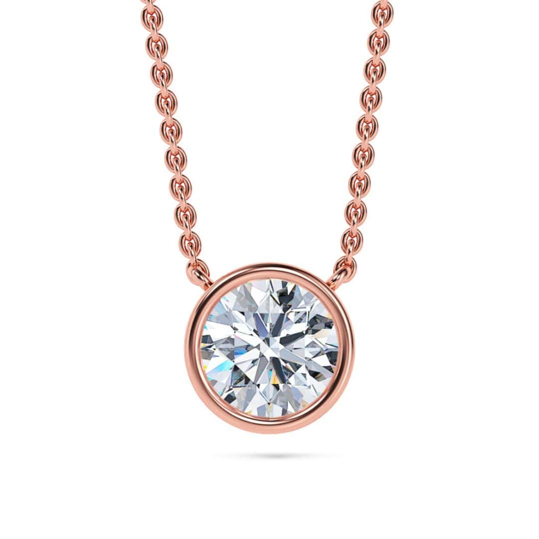 Elegant rose gold necklace with a round bezel-set solitaire diamond pendant. Perfect for sophisticat.