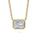 Elegant gold necklace with a large, radiant bezel-set diamond pendant. Perfect for sophisticated jew.