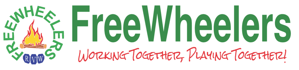 Group of people playing games outdoors at a FreeWheelers community event, promoting teamwork and fun.