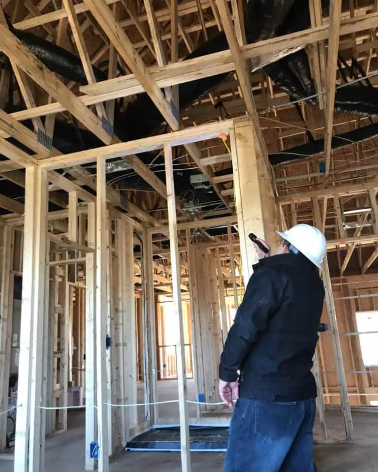 Inspector inspecting ceiling framework