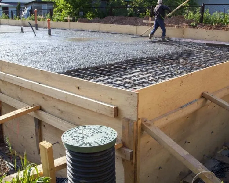 Concrete pouring into foundation