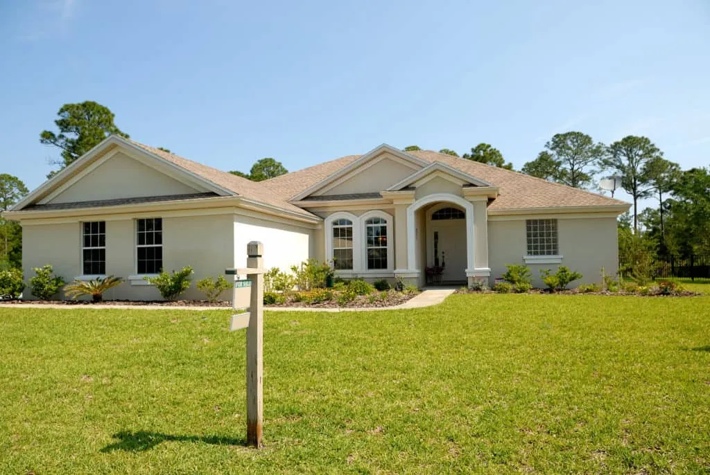Single-family home with a sale sign