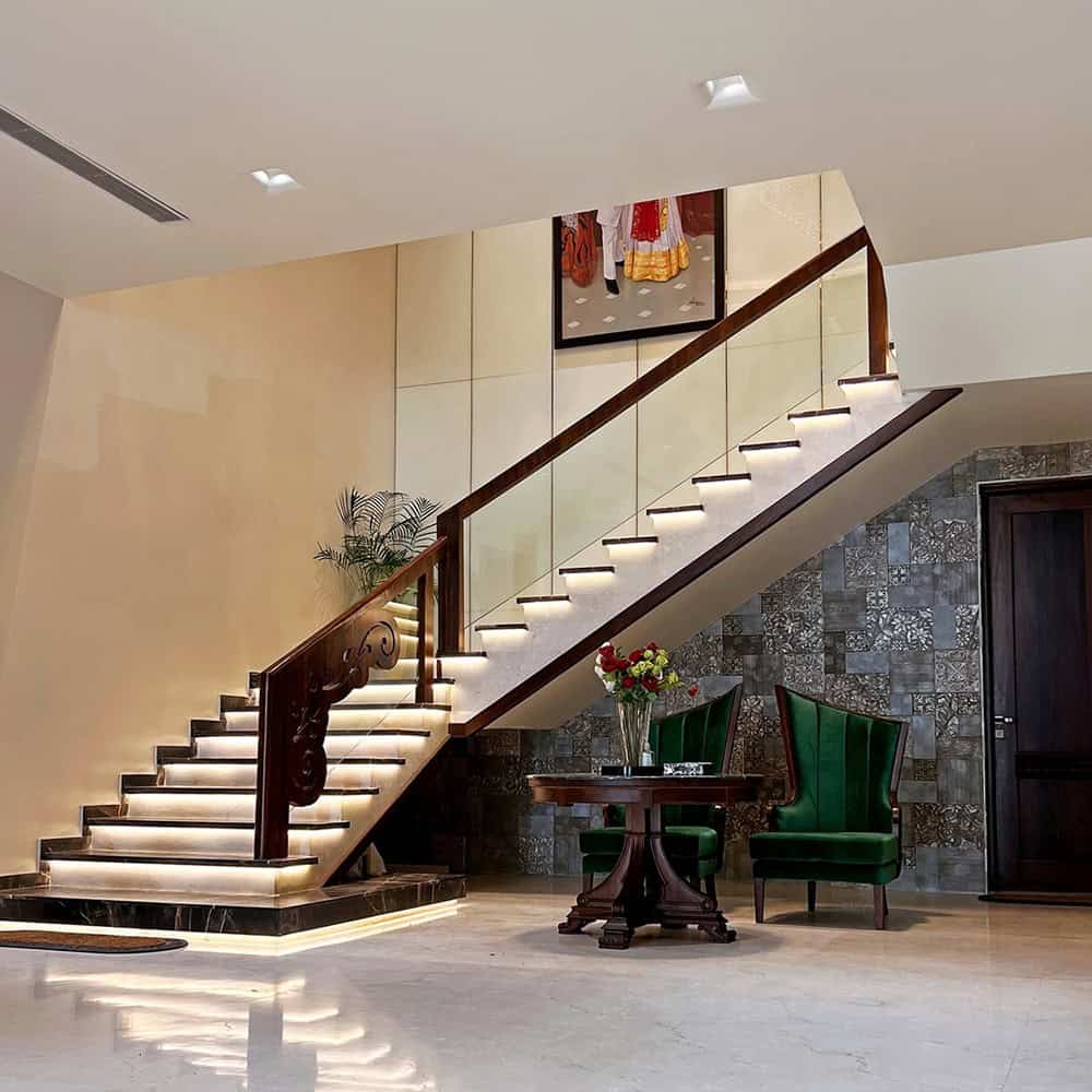 Elegant staircase with LED lighting in modern interior design.