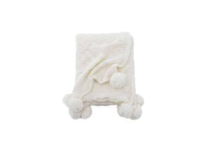 Bomullsmössa med pom-poms, perfekt för vinter och kyliga dagar.