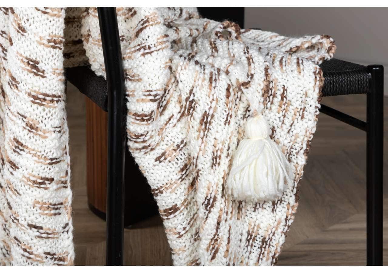 Mjuk bomullstapet i beige och vit, perfekt för mysiga sovrum.