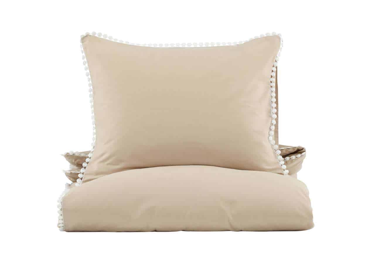 Mjuk och lyxig sovrumsstöd i beige med dekorativa knappar, perfekt för mysiga sovaftnar.