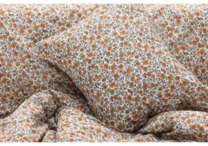 Fint blommigt sängkläder i ekologiskt ekologiskt bomull, perfekt för en skön sömn.