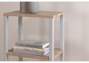 Vacker sängfabrik i trä- och metalldesign, perfekt för sovrum eller vardagsrum.