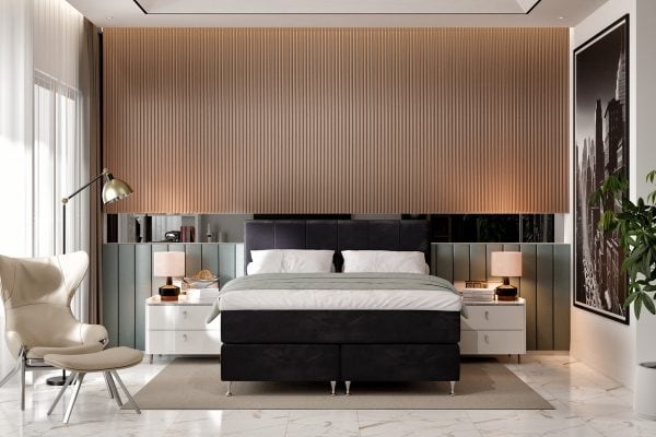 Elegant svart säng i modern hotellstil med lyxiga sängkläder och stilfull inredning.