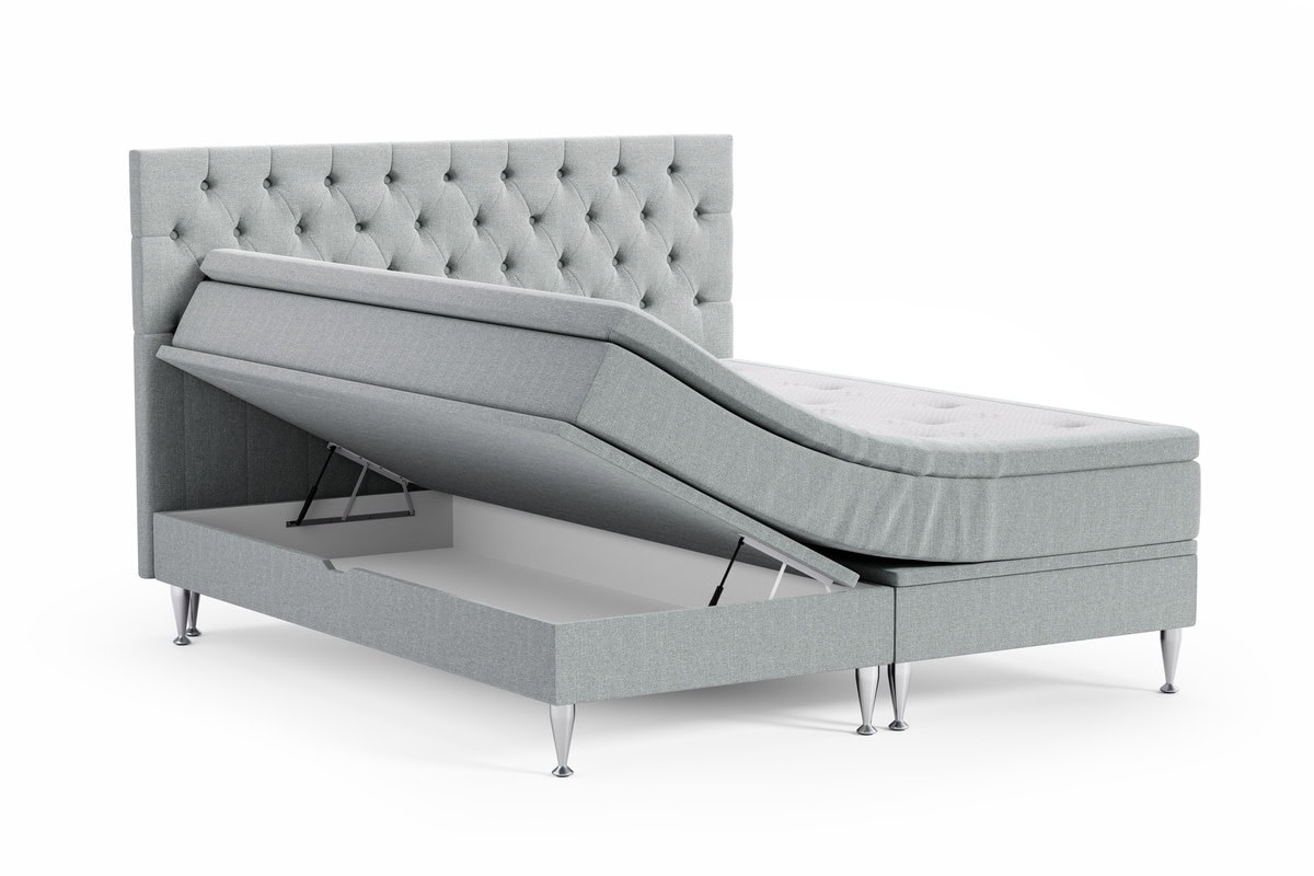 Säng med förvaring och lyft och vackert tuftad huvudgavel.