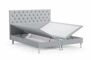 Högkvalitativ säng med smart förvaring och elegant design.