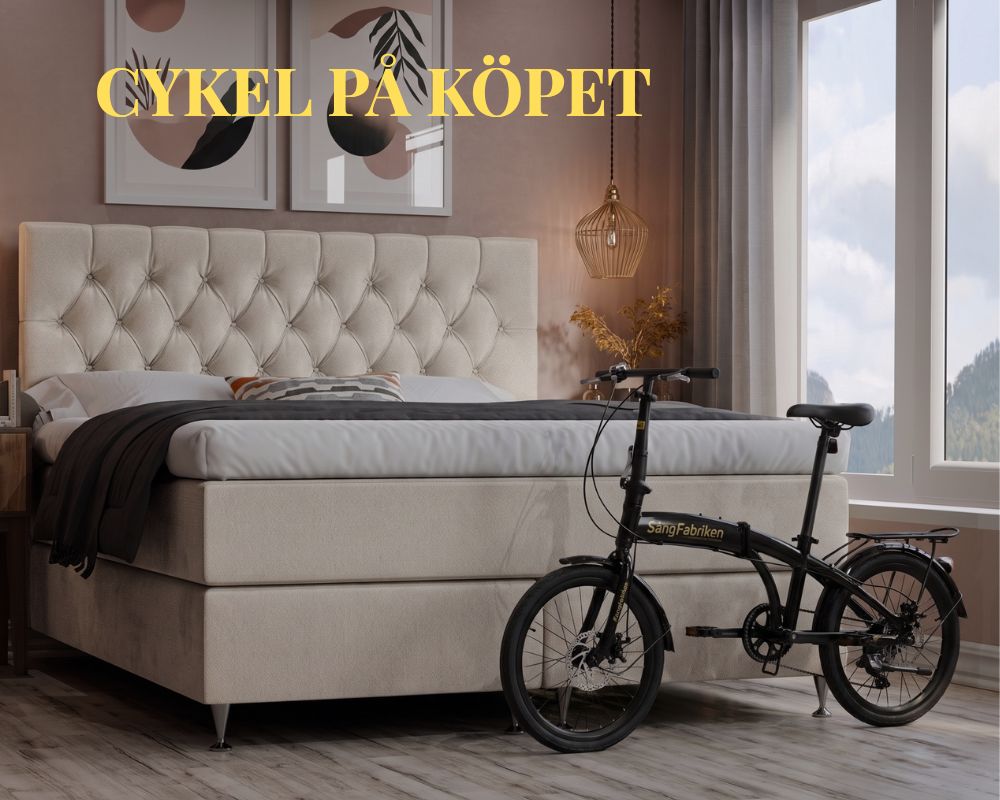 Sängfabriken - Elegant sovrum med cykel vid sängens fotända.