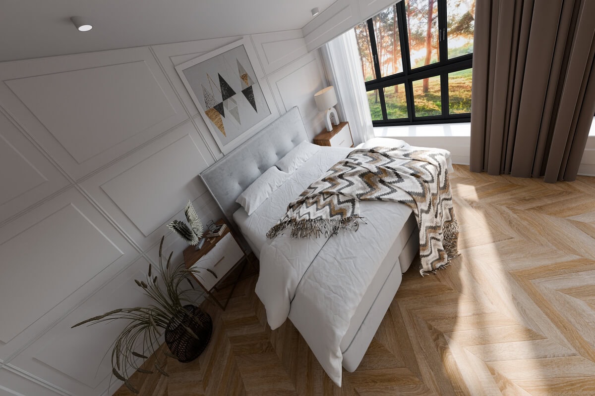 Elegant sovrum med modern inredning och stora fönster för naturligt ljus.