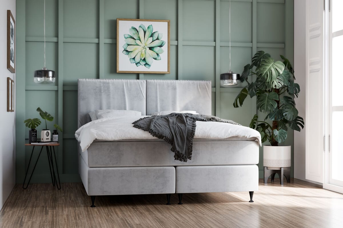 Elegant sovrum med bekvämt säng och modern inredning.