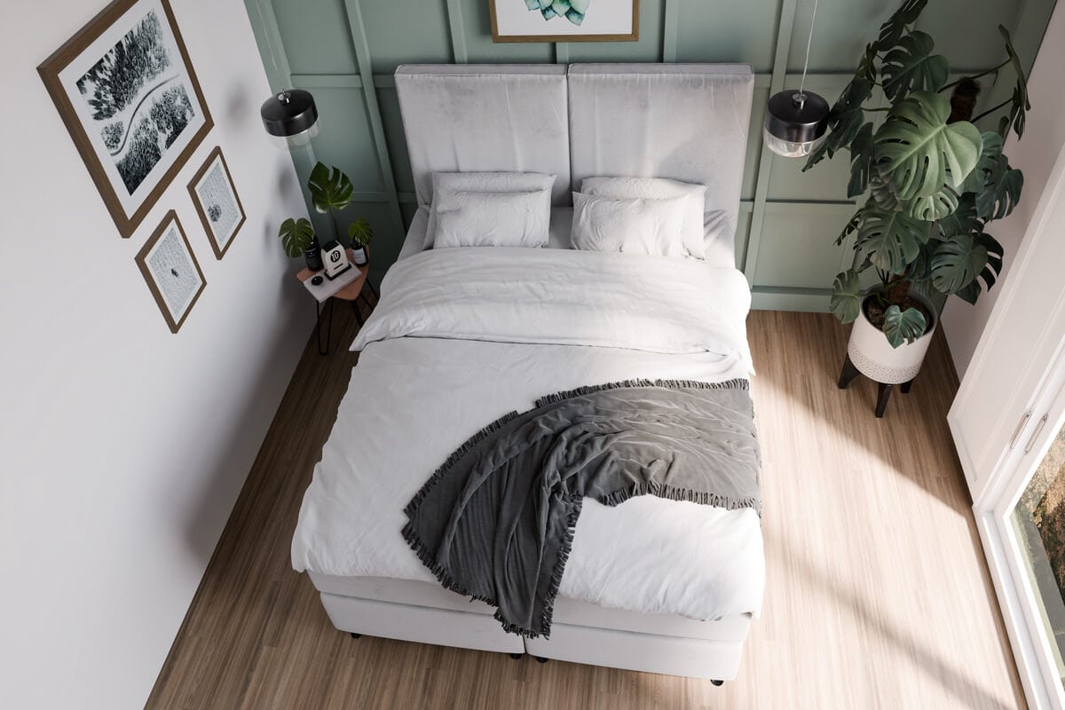 Elegant sovrum med bekvämt säng och moderna inredningsdetaljer.