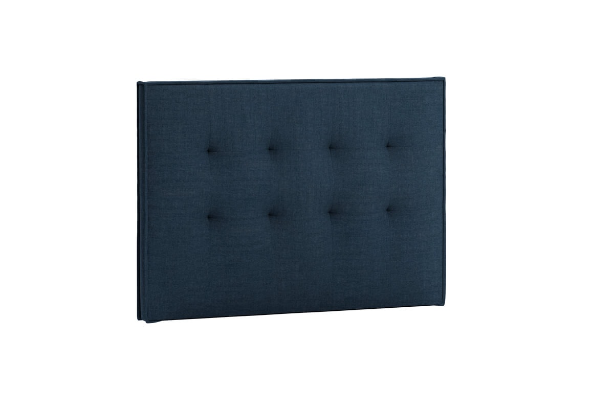 Sänggavel i mörkblått tyg för modern sovrumsinredning.