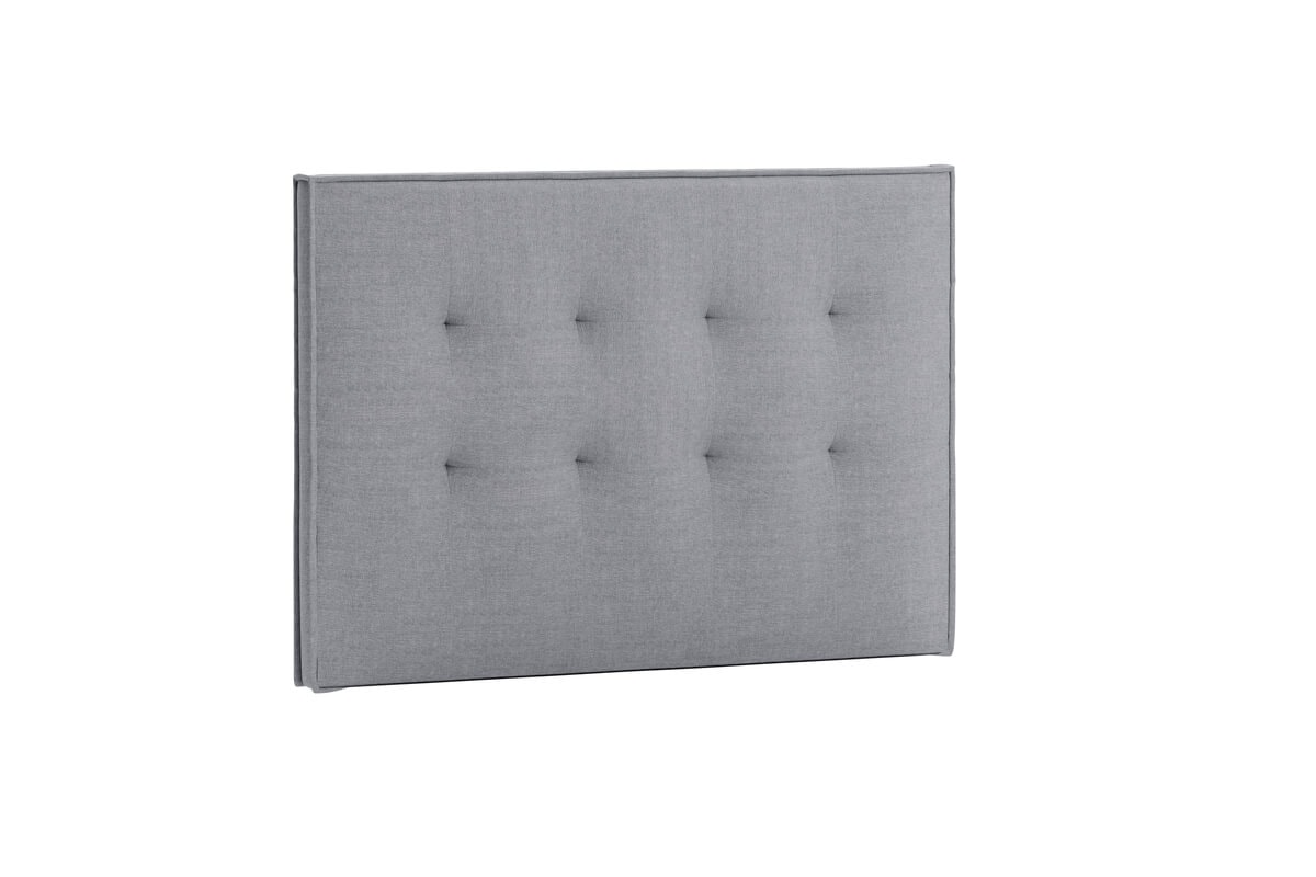 Sänggavel i grått tyg för modern sovrumsinredning.