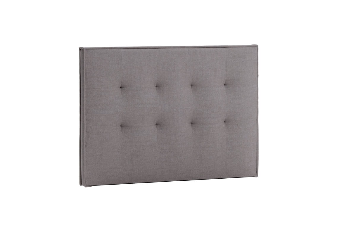 Sänggavel i grått tyg för modern sovrumsinredning.