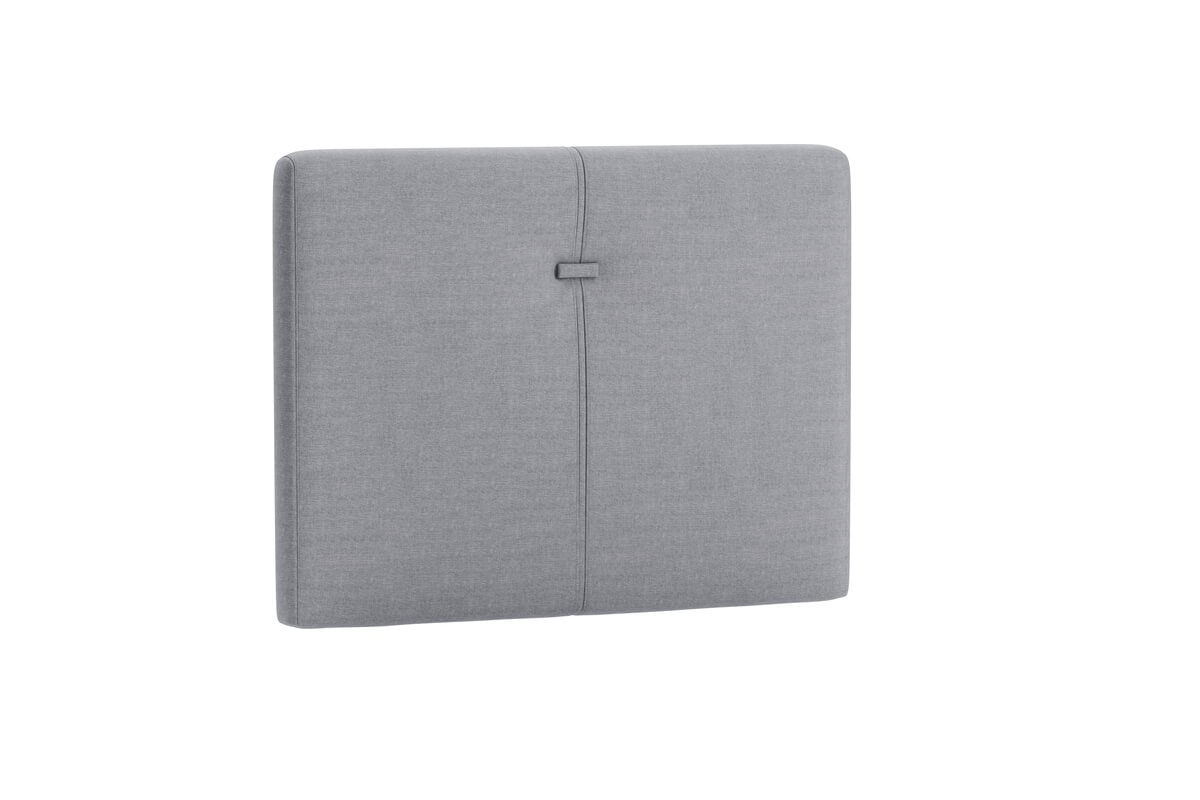 Sänggavel i grått tyg för modern sovrumsinredning.