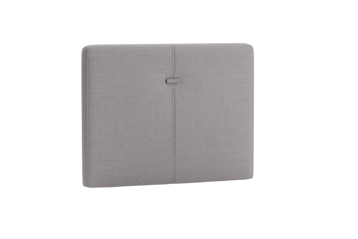 Sänggavel i grått tyg för modern sovrumsmiljö.