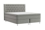 Sängram med tuftad huvudgavel i ljusgrått tyg, modern design.